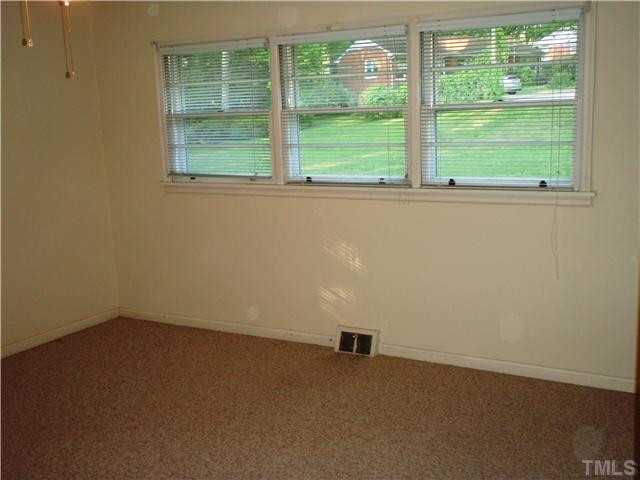 2921 Barmettler Street Raleigh, NC 27607 - Photo 8 of 12 an empty room with a window