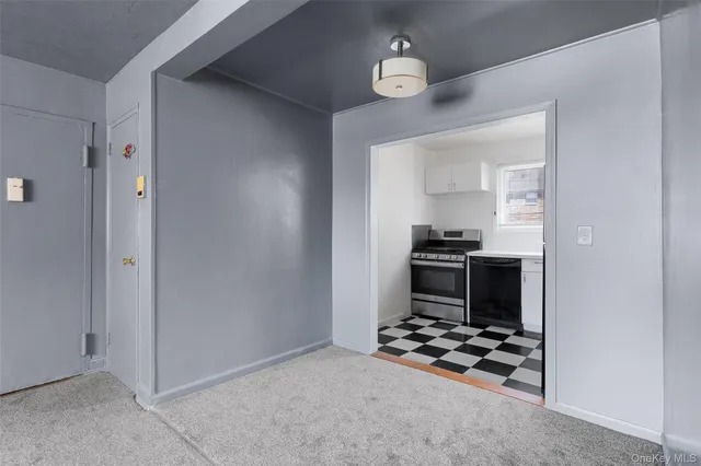 a kitchen with granite countertop a stove and a refrigerator