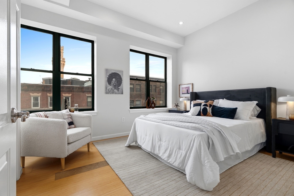 40 Fay Street, Unit 406 Boston, MA 02118 - Photo 11 of 19 a bedroom with bed and large windows