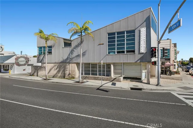 a view of a street with a building on the road