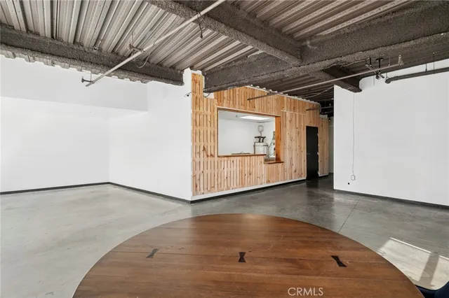a view of a room with wooden walls