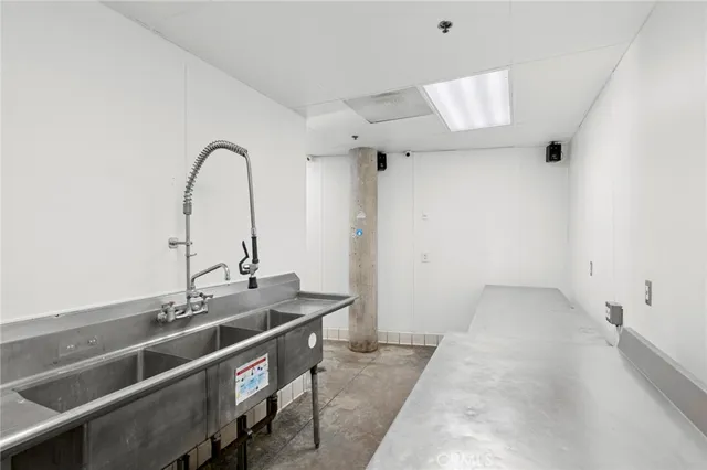 a view of a bathroom with a sink and mirror