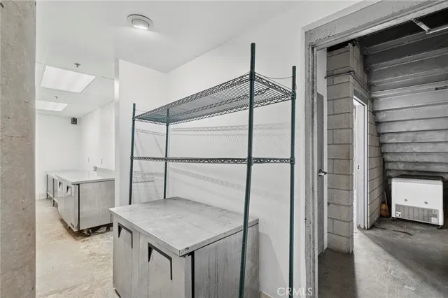 a kitchen with a refrigerator a sink and cabinets