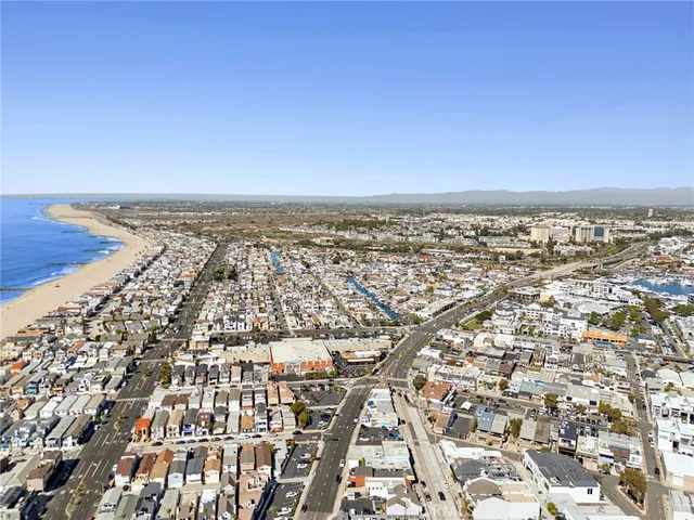 an aerial view of residential building and car parked