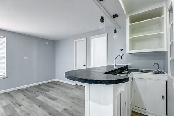 a kitchen with stainless steel appliances a refrigerator and cabinets
