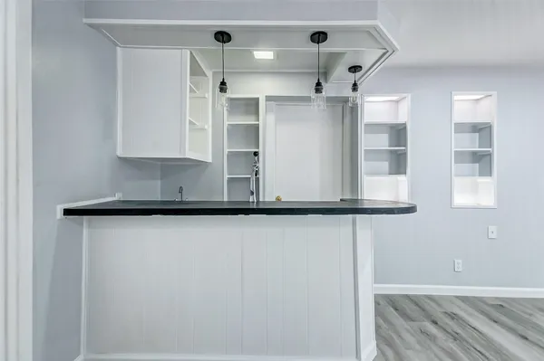 a bathroom with a toilet sink and shower