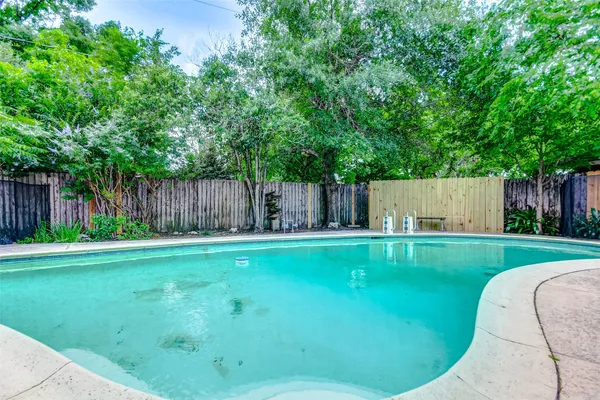 a view of a backyard with a patio