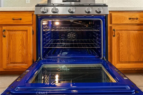 a view of a room with wooden floor and windows