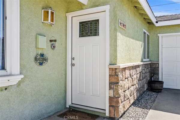 a view of empty room with fireplace and wooden floor