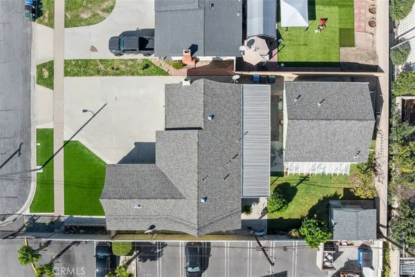 an aerial view of residential building and ocean