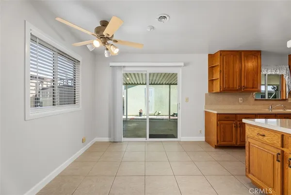 a spacious bathroom with a double vanity sink a mirror and a bathtub