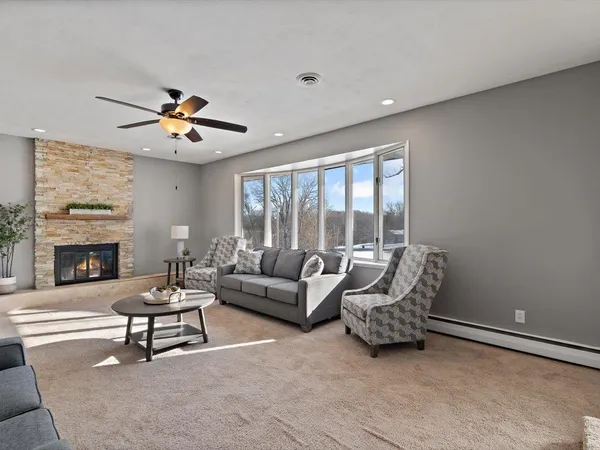 a living room with furniture and chandelier