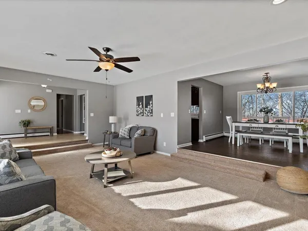 a view of a dining room with furniture and window