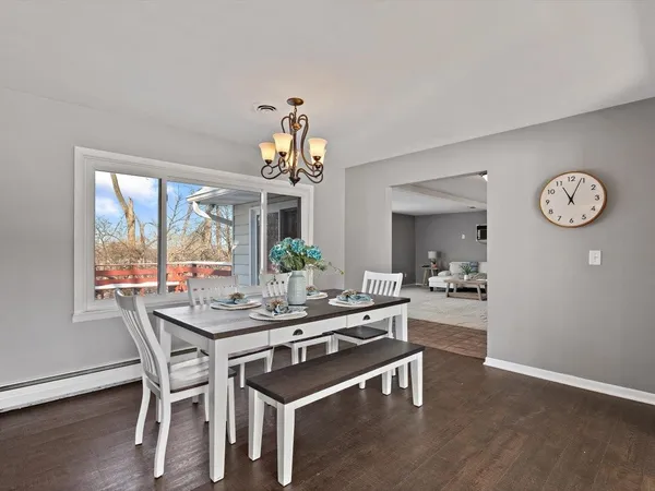a living room with furniture and next to a window