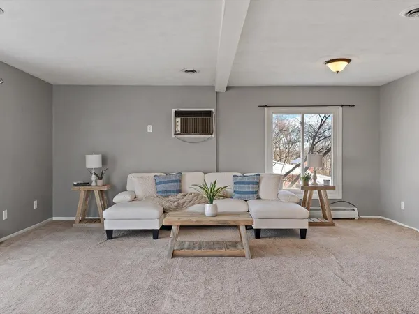 a kitchen with stainless steel appliances granite countertop a stove and a refrigerator