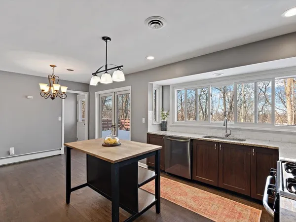a bedroom with a bed and a ceiling fan