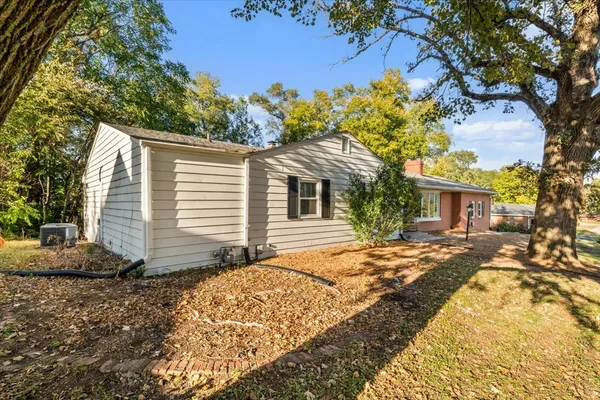 a view of a house with a yard and garage