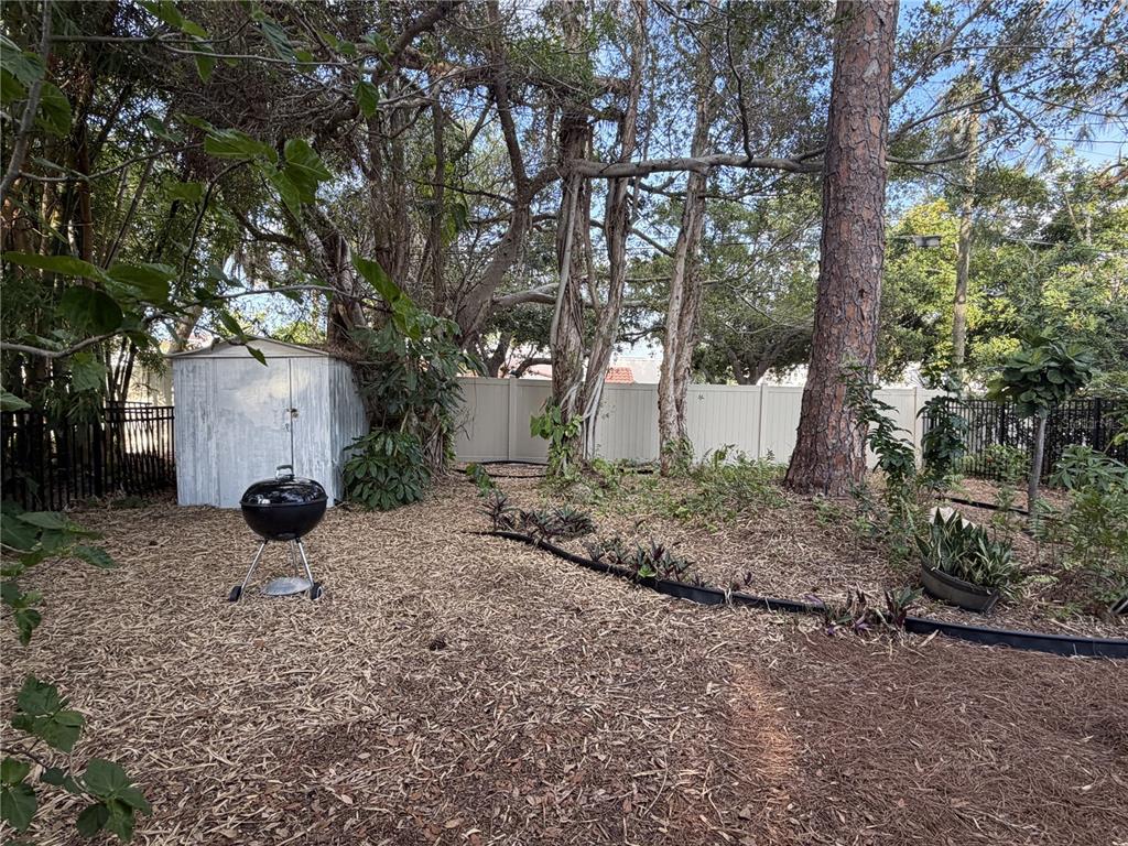 421 Riviera Street Venice, FL 34285 - Photo 18 of 30 a view of a yard with plants and trees