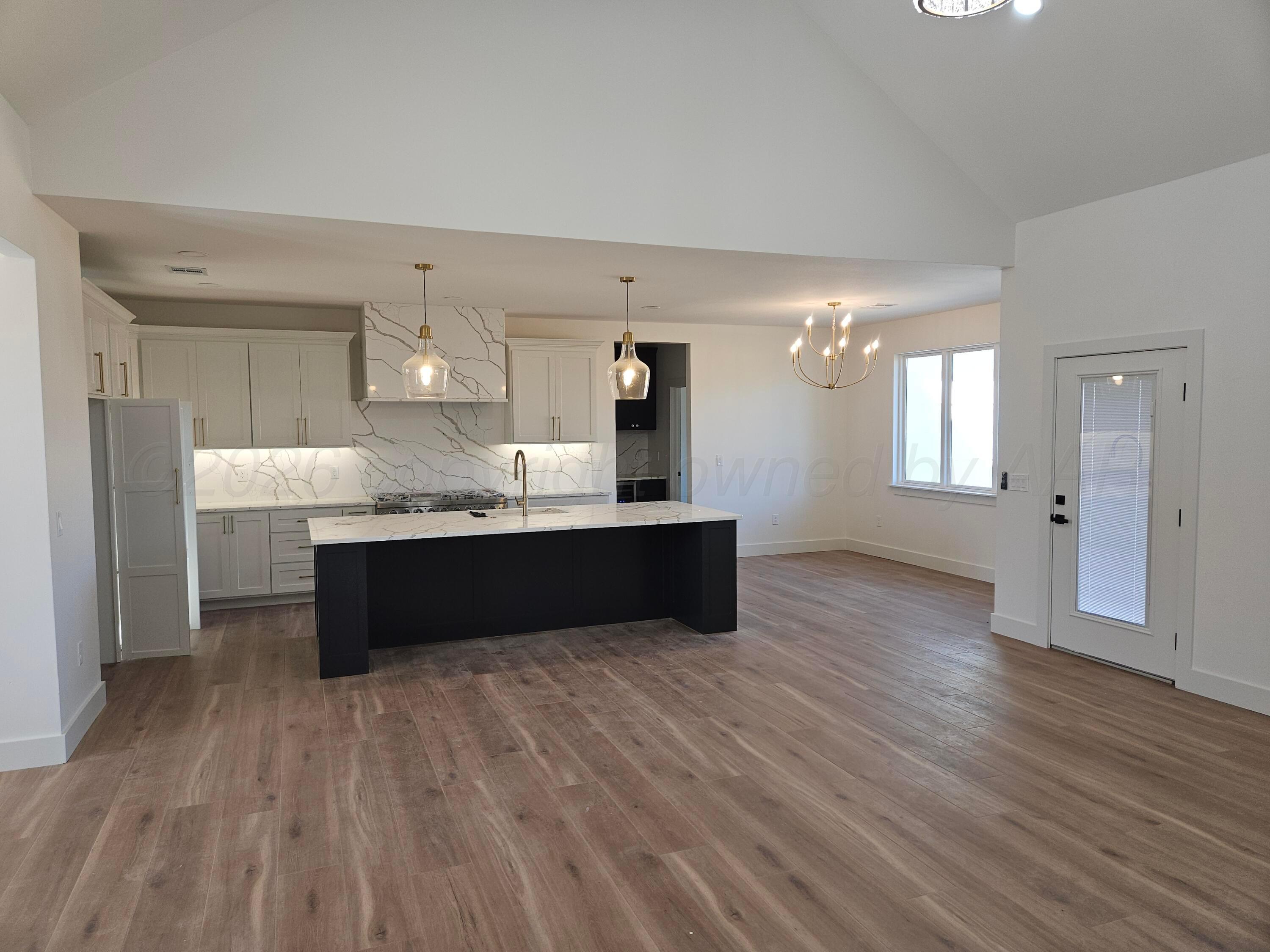 1010 Oak Avenue Panhandle, TX 79068 - Photo 15 of 44 a kitchen with granite countertop a sink and cabinets