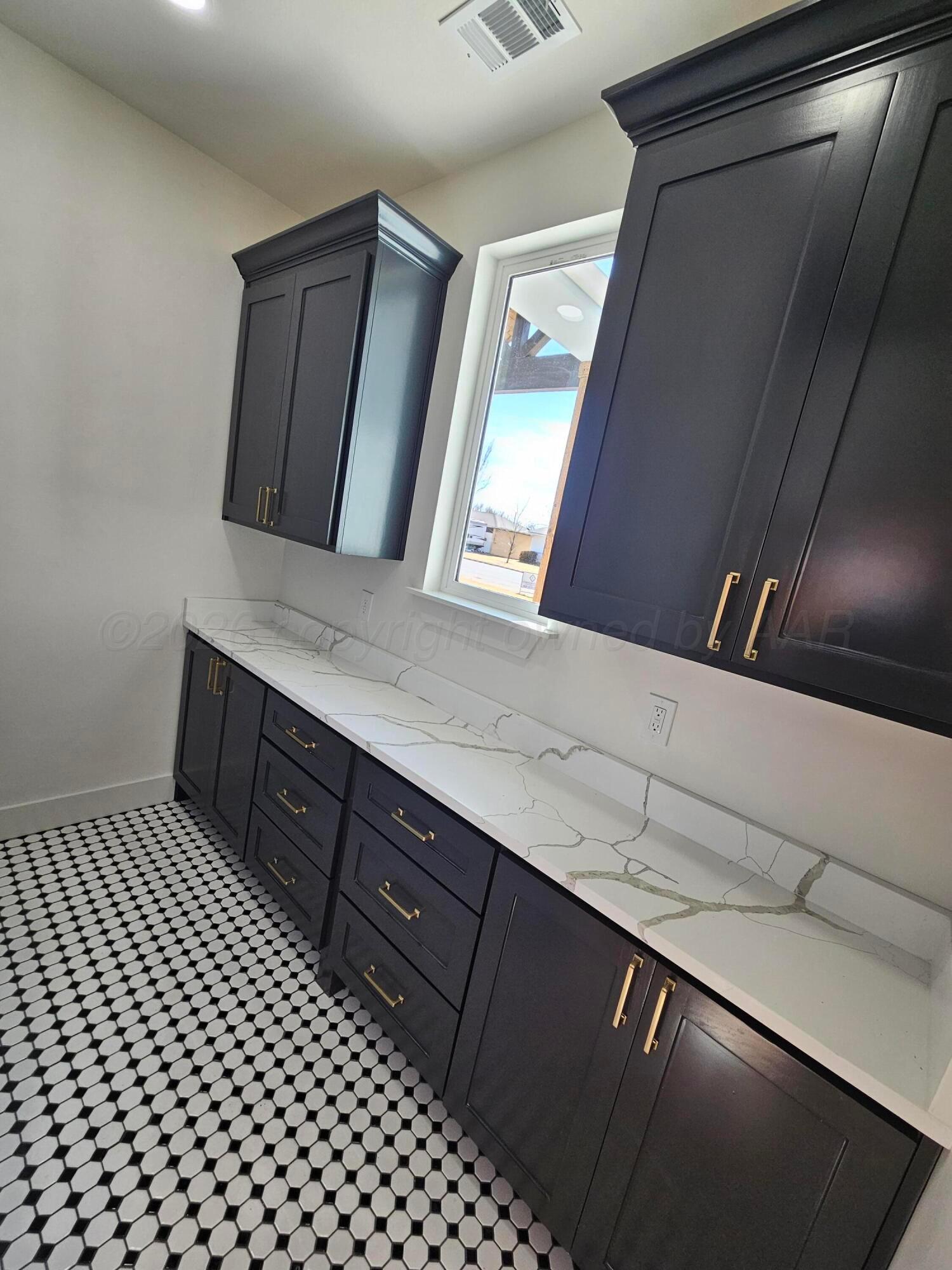 1010 Oak Avenue Panhandle, TX 79068 - Photo 18 of 44 a bathroom with a sink a mirror and vanity