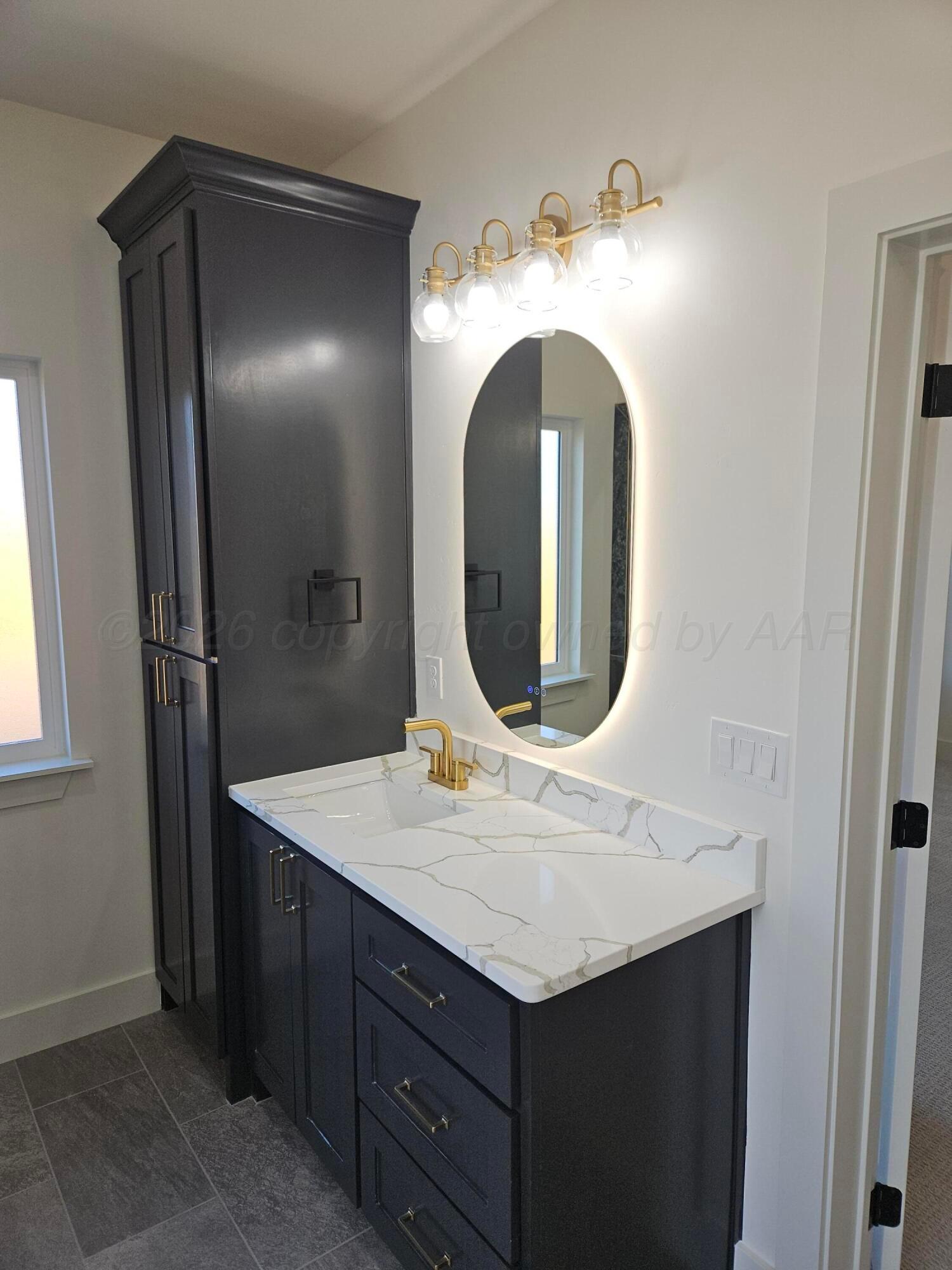 1010 Oak Avenue Panhandle, TX 79068 - Photo 26 of 44 a bathroom with a sink and a mirror