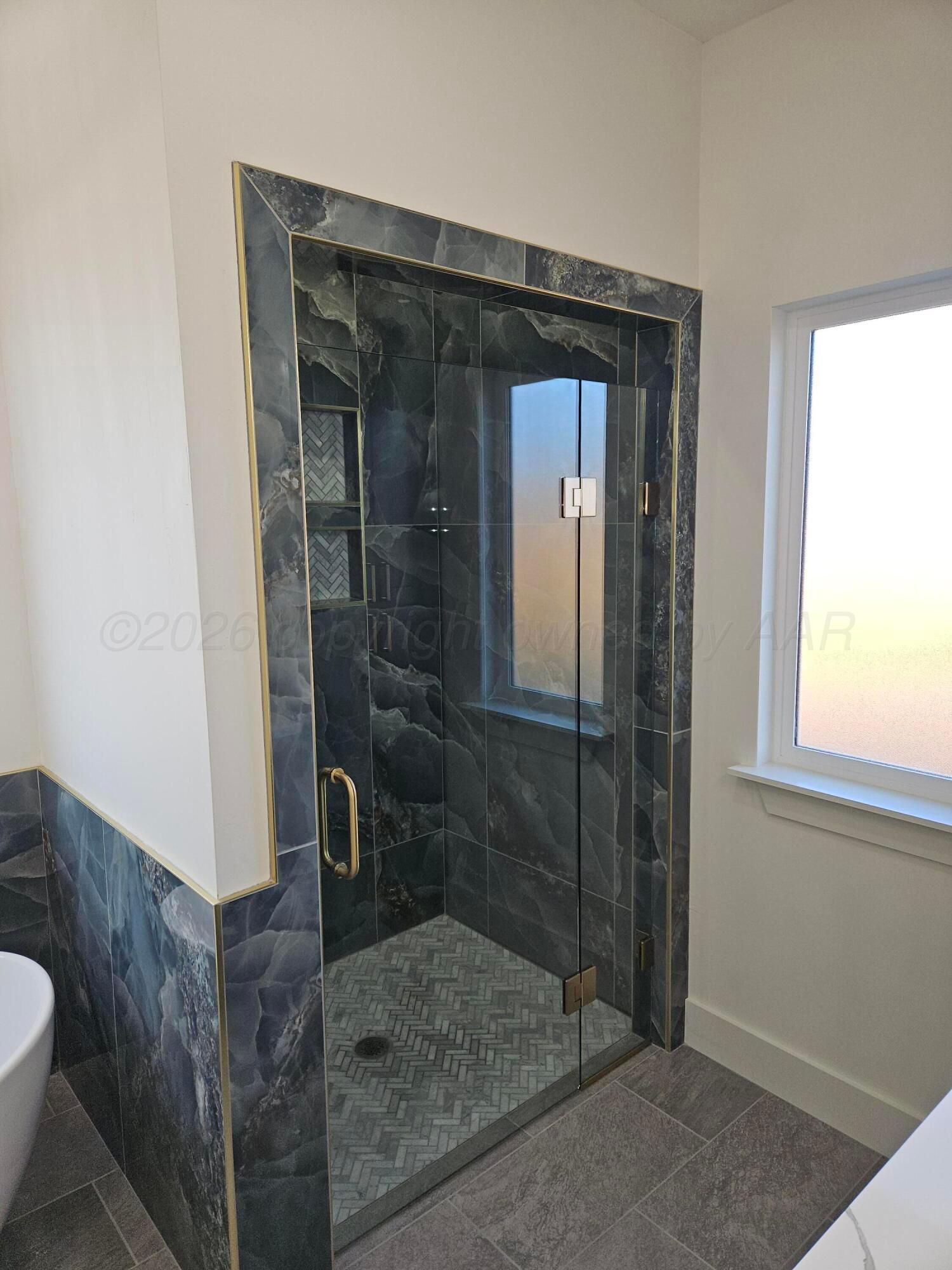 1010 Oak Avenue Panhandle, TX 79068 - Photo 30 of 44 a bathroom with a shower and toilet
