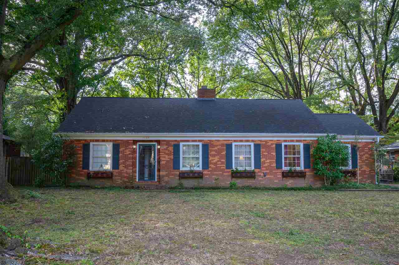 Solid, spacious 2600 square foot brick in great neighborhood.  Wood floors up and down.5 bedrooms or 4 and an office, 3 baths plus charming screened porch and double garage with attached workshop all sitting on a large park-like yard.