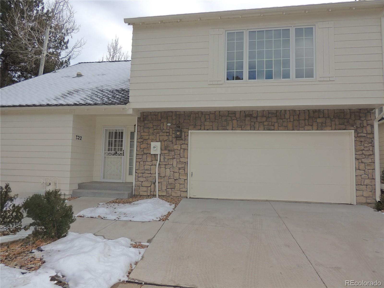 4530 South Verbena Street, Unit 322 Denver, CO 80237 - Photo 1 of 27 a front view of a house with a yard