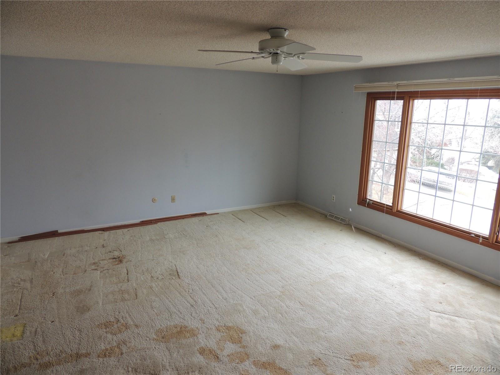 4530 South Verbena Street, Unit 322 Denver, CO 80237 - Photo 16 of 27 a view of an empty room with a window
