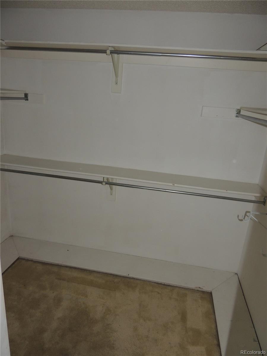 4530 South Verbena Street, Unit 322 Denver, CO 80237 - Photo 22 of 27 a view of a room with racks on the wall