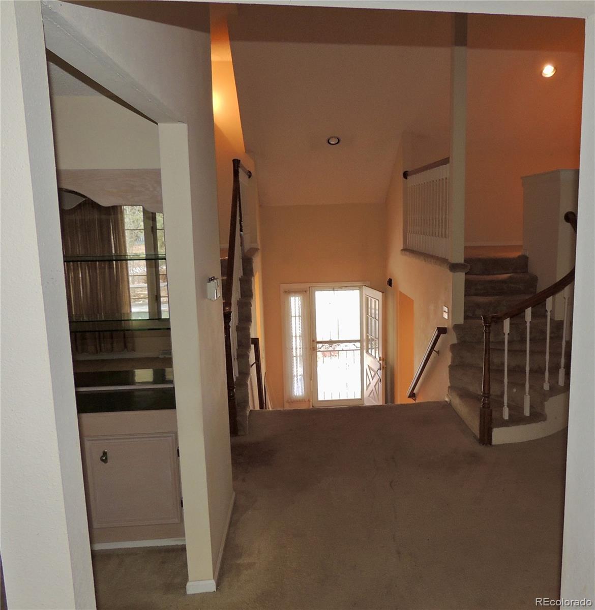 4530 South Verbena Street, Unit 322 Denver, CO 80237 - Photo 25 of 27 a view of hallway with stairs and wooden floor