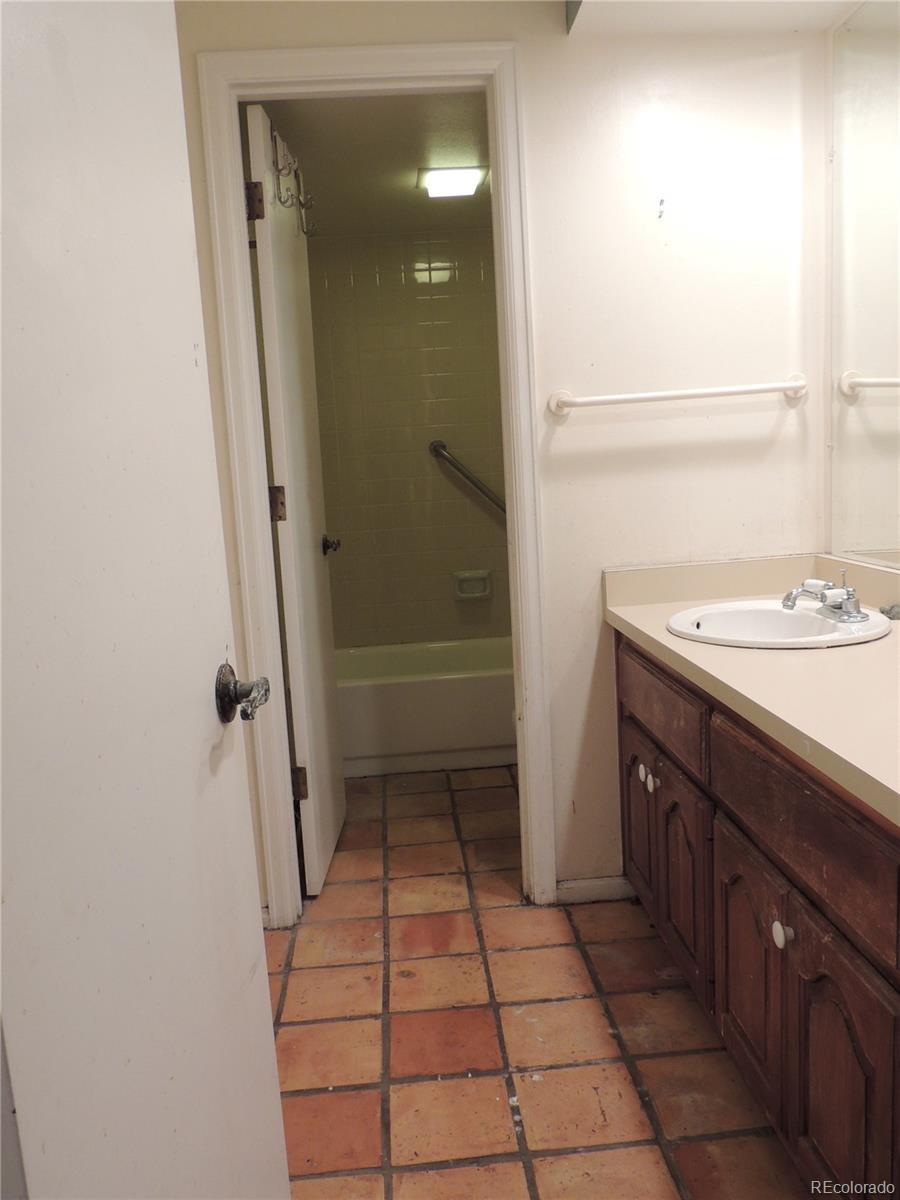 4530 South Verbena Street, Unit 322 Denver, CO 80237 - Photo 5 of 27 a bathroom with a sink a toilet and shower