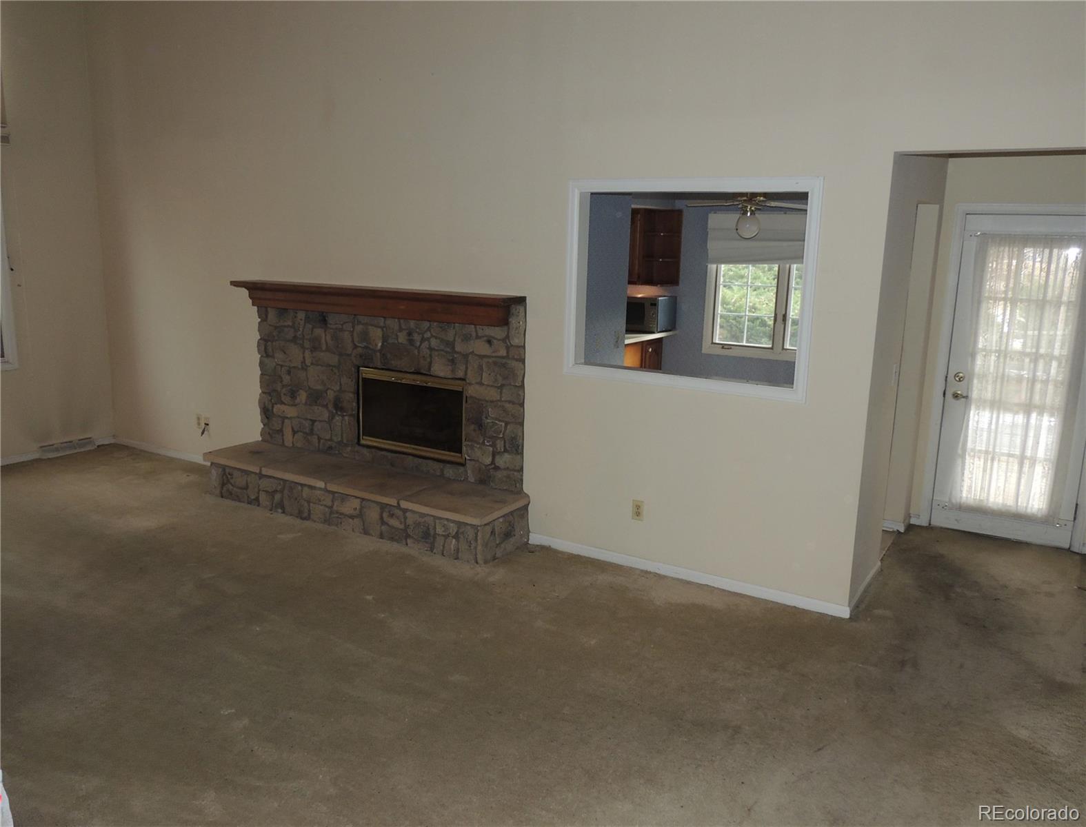 4530 South Verbena Street, Unit 322 Denver, CO 80237 - Photo 6 of 27 an empty room with windows