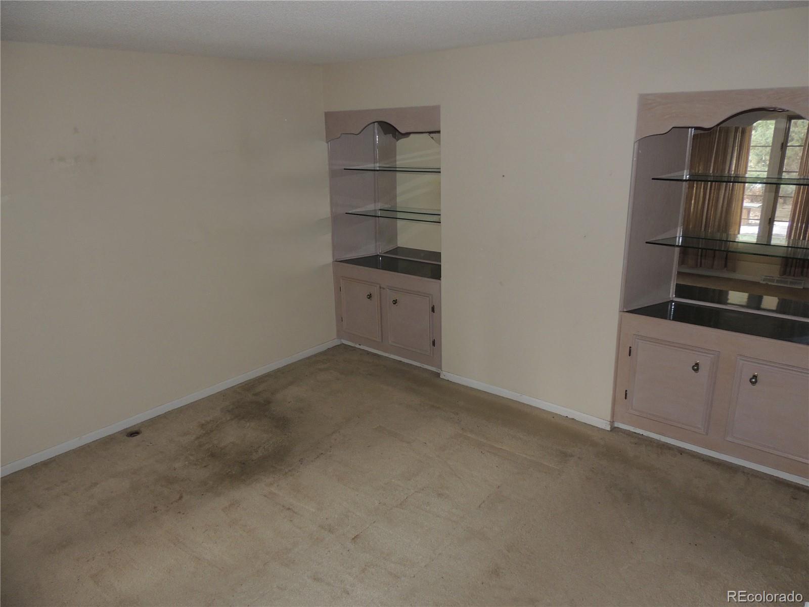 4530 South Verbena Street, Unit 322 Denver, CO 80237 - Photo 10 of 27 an empty room with cabinet