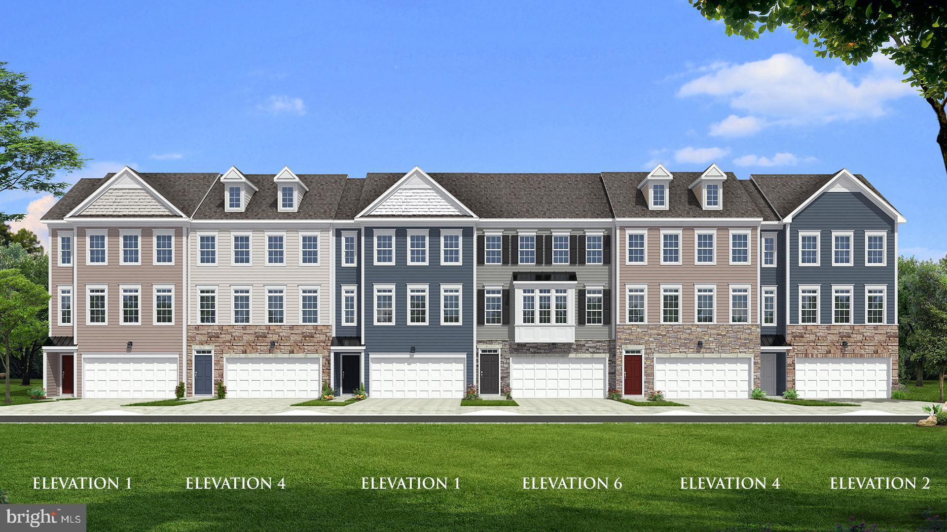 a front view of a residential apartment building with a yard