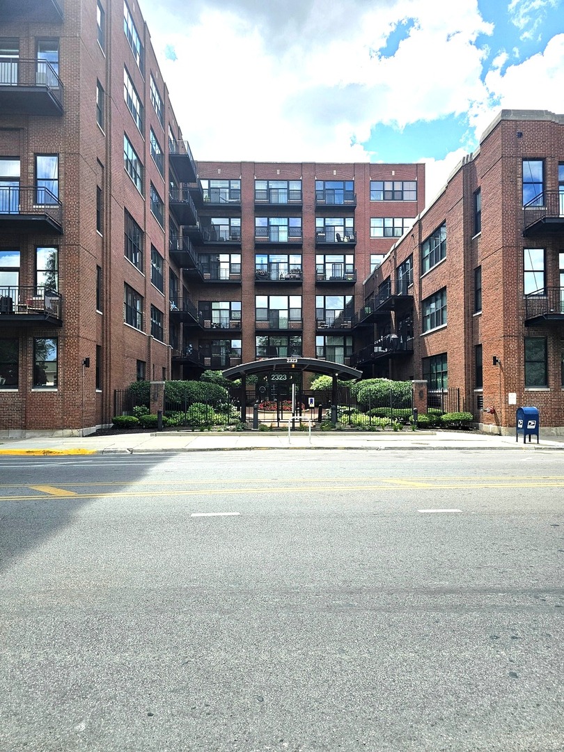 2323 West Pershing Road, Unit 230 Chicago, IL 60609 - Photo 2 of 30 a view of a building with a street