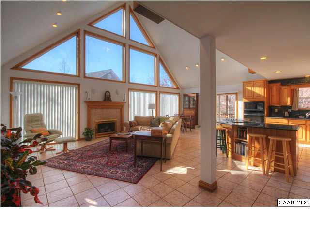 27 Tanglewood Road Palmyra, VA 22963 - Photo 3 of 23 Vaulted Greatroom features Imported Tile Floor, View to Kitchen and Lake.