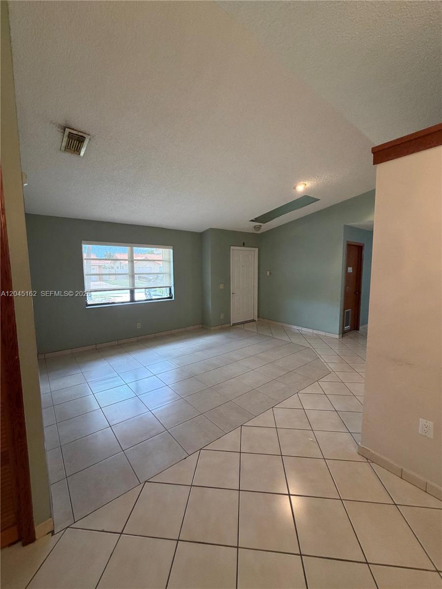 3262 Southwest 139th Place Miami, FL 33175 - Photo 5 of 36 a view of an empty room and window