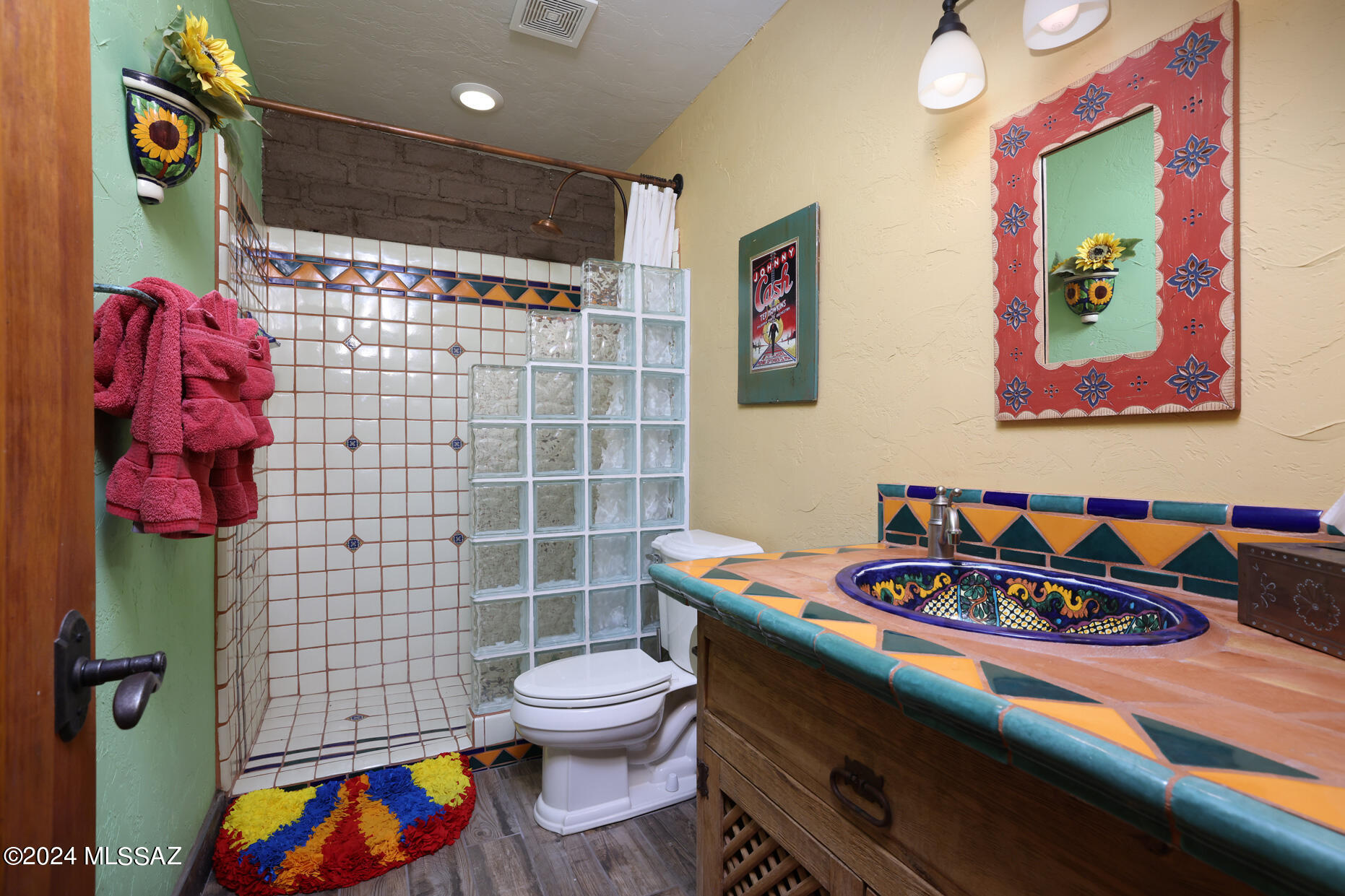 11725 East Spanish Ridge Place Tucson, AZ 85730 - Photo 39 of 51 a bathroom with a sink toilet and shower