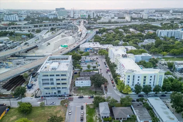 an aerial view of residential house with outdoor space and swimming pool