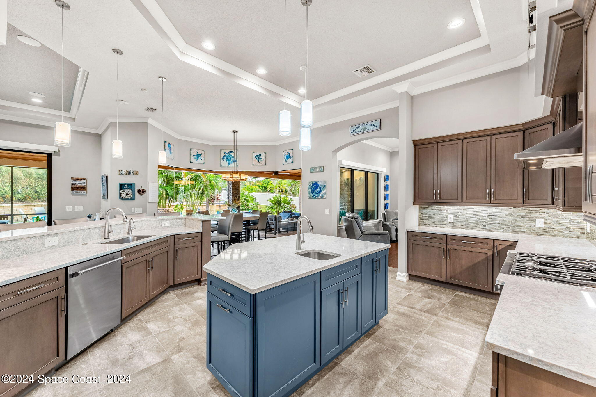 213 Loggerhead Drive Melbourne Beach, FL 32951 - Photo 20 of 58 a large kitchen with a large counter top sink and appliances