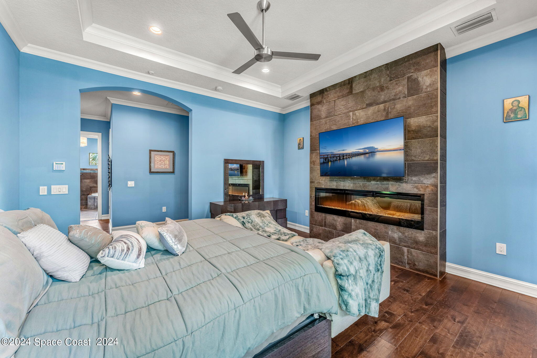 213 Loggerhead Drive Melbourne Beach, FL 32951 - Photo 25 of 58 a bedroom with a bed and a flat screen tv