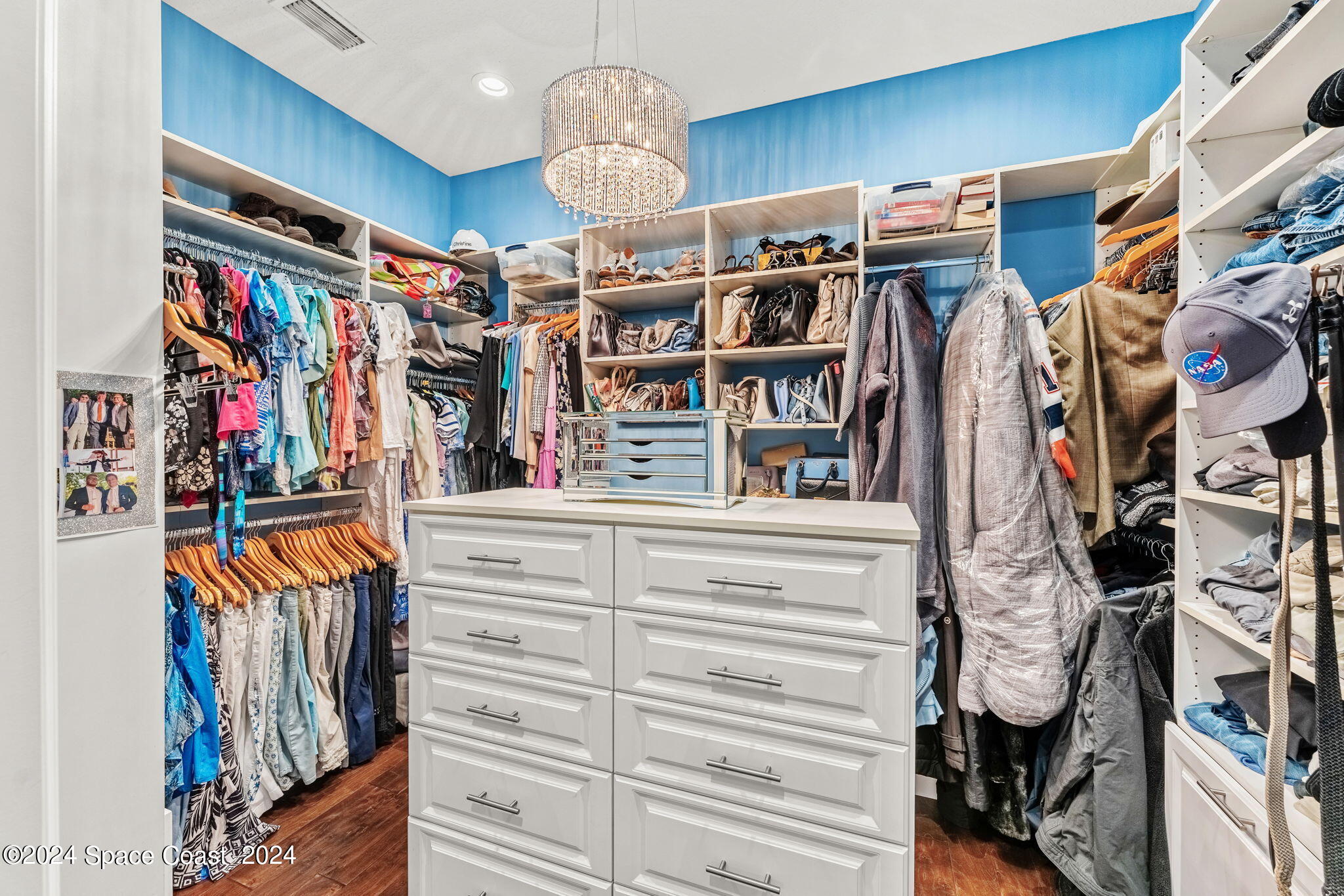 213 Loggerhead Drive Melbourne Beach, FL 32951 - Photo 28 of 58 a view of walk in closet with clothes and shoes
