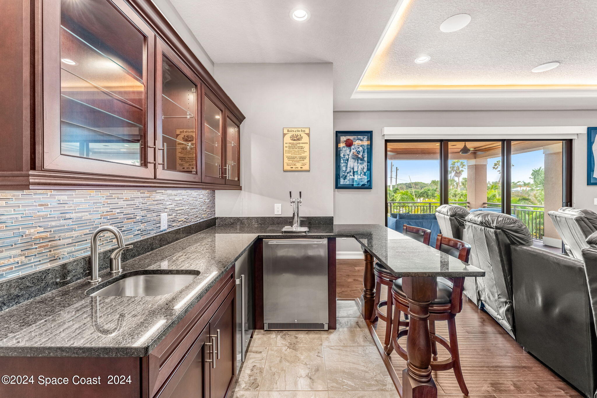 213 Loggerhead Drive Melbourne Beach, FL 32951 - Photo 37 of 58 a kitchen with a stove a sink and a refrigerator