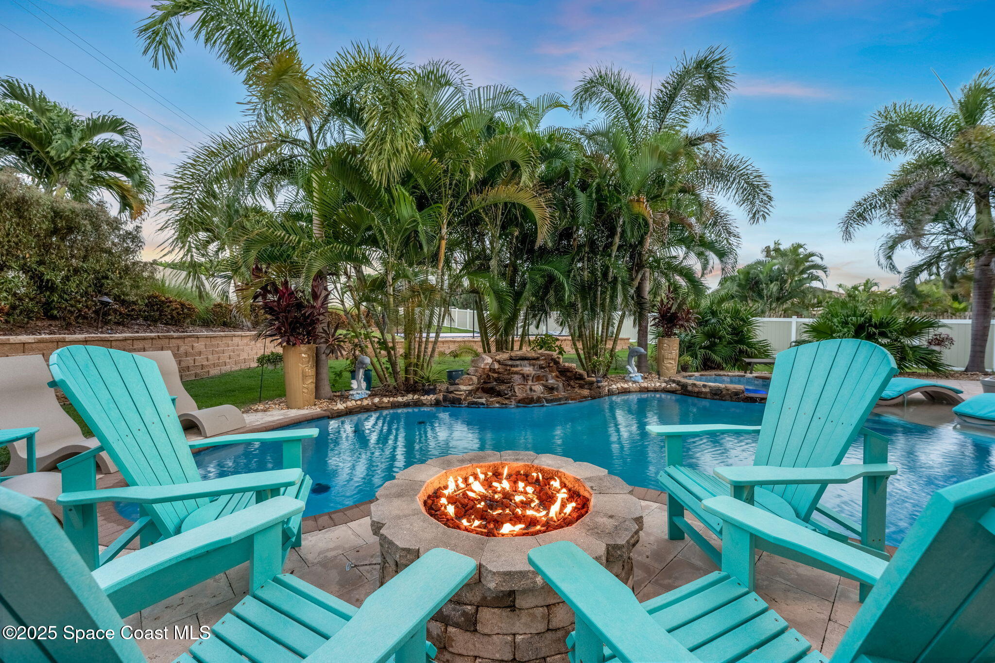 213 Loggerhead Drive Melbourne Beach, FL 32951 - Photo 50 of 58 swimming pool with outdoor seating and yard