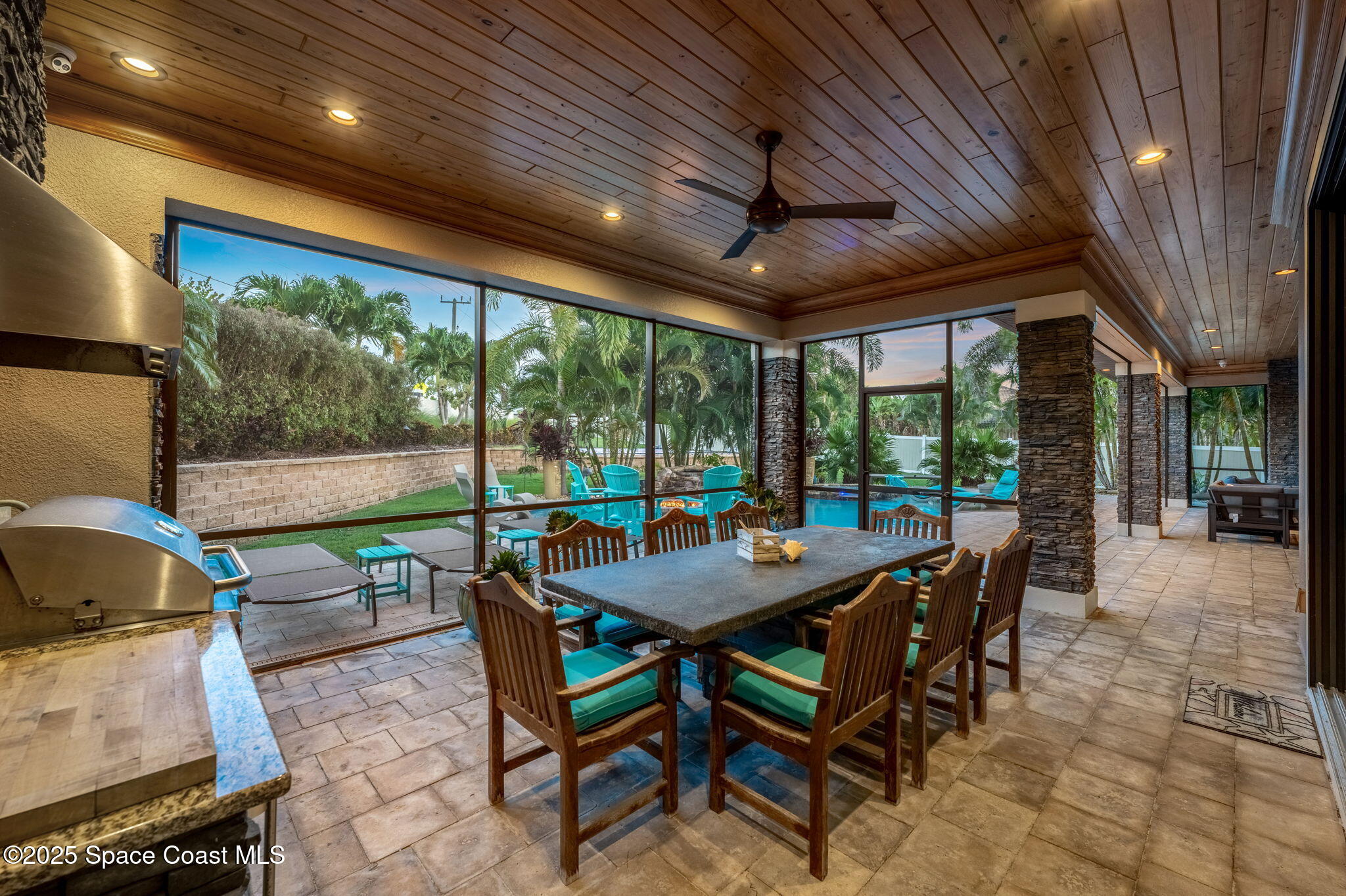 213 Loggerhead Drive Melbourne Beach, FL 32951 - Photo 51 of 58 a dining room with furniture water view and a floor to ceiling window