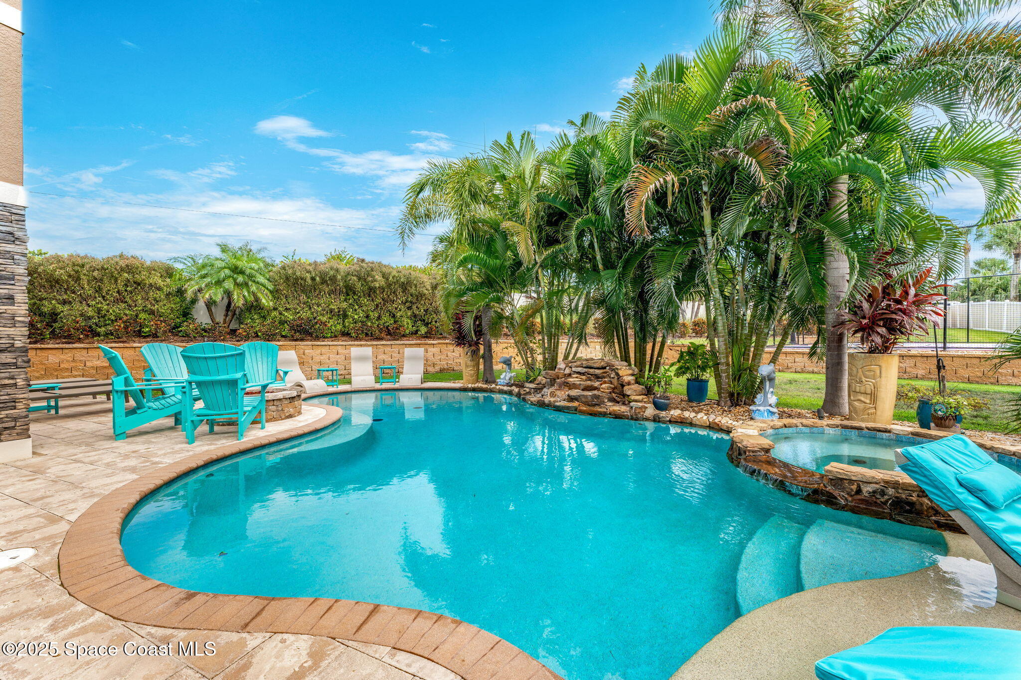 213 Loggerhead Drive Melbourne Beach, FL 32951 - Photo 7 of 58 a view of a swimming pool with lawn chairs