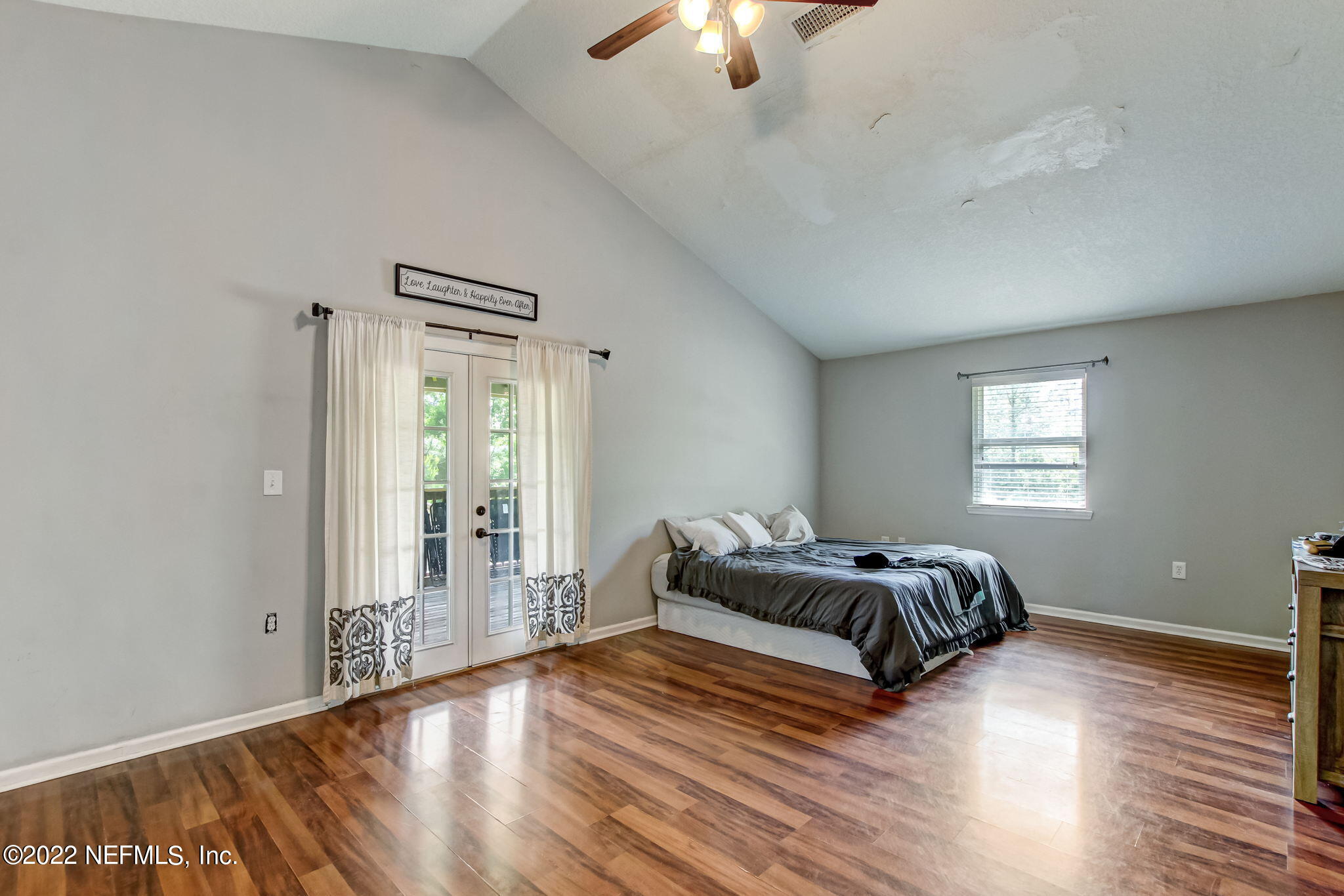 75004 Edwards Road Yulee, FL 32097 - Photo 23 of 62 a bedroom with a bed and wooden floor