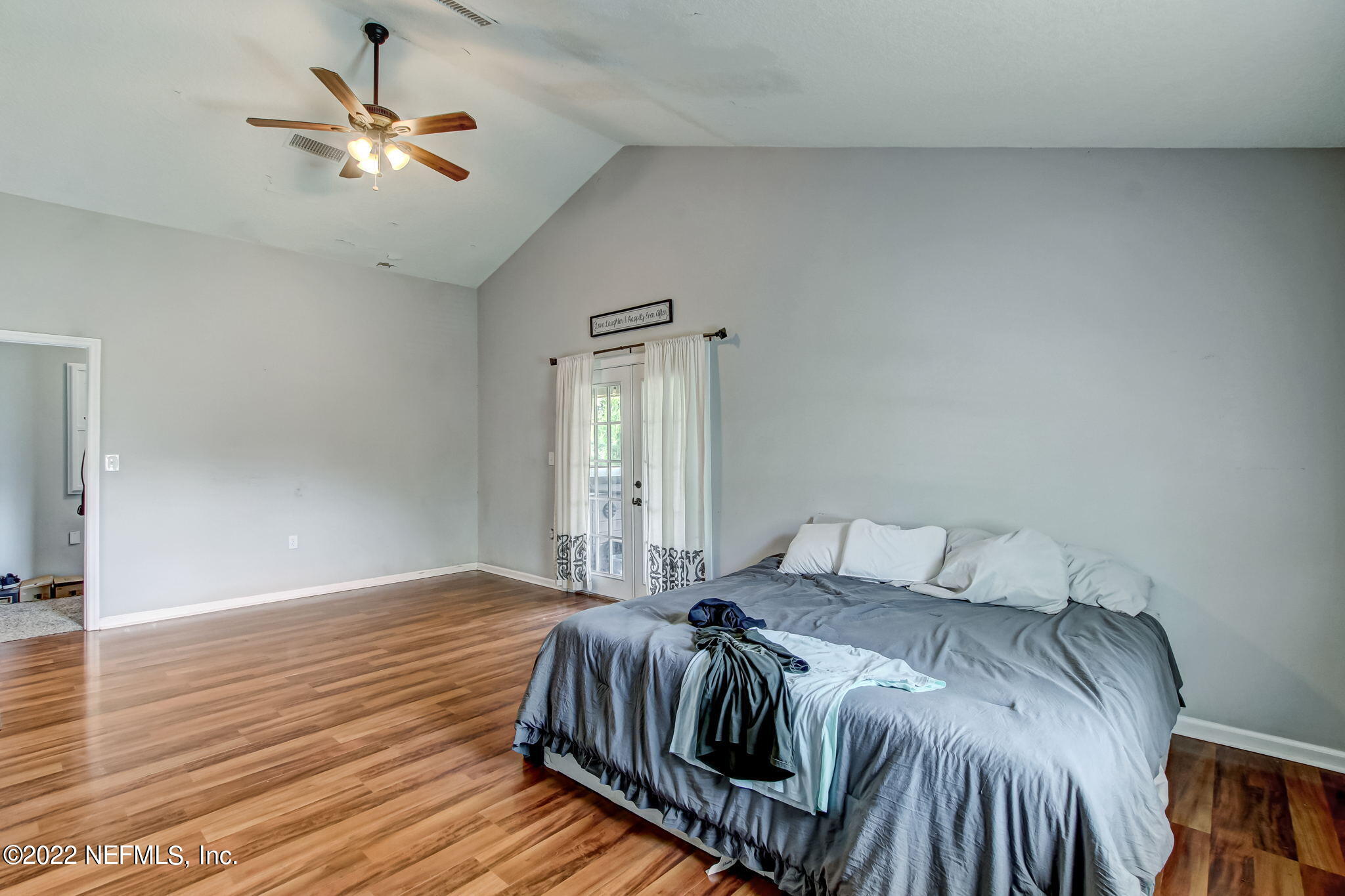 75004 Edwards Road Yulee, FL 32097 - Photo 24 of 62 a bedroom with a bed and a ceiling fan