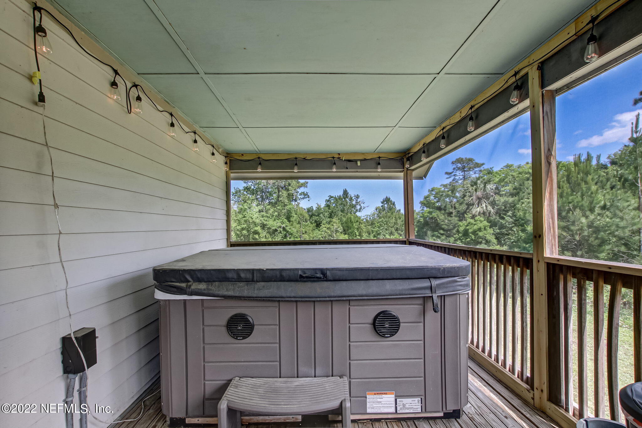 75004 Edwards Road Yulee, FL 32097 - Photo 31 of 62 a view of a door and chair in the balcony